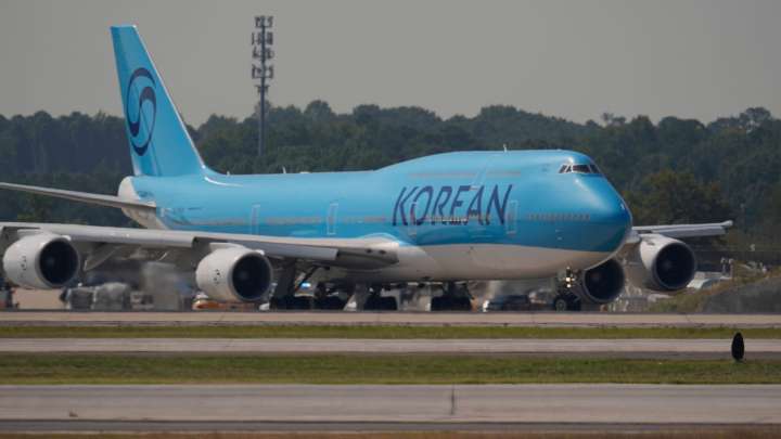 South Korean workers detained in immigration raid head home
