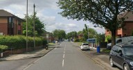 Emergency services storm Greater Manchester street following 'disturbance'