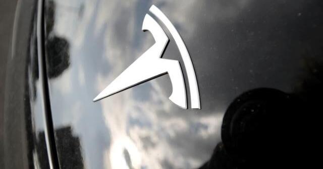 Tesla under investigation after parents say faulty door handles trapped their kids in the back