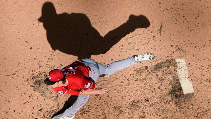 Reds lose 4-2 to the Brewers but end up in playoffs anyway after Mets fall