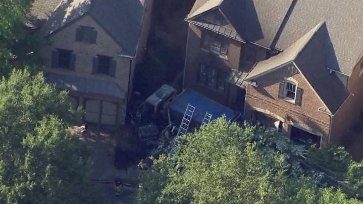 Garbage truck driver loses control, crashes into parked car at Cobb County home