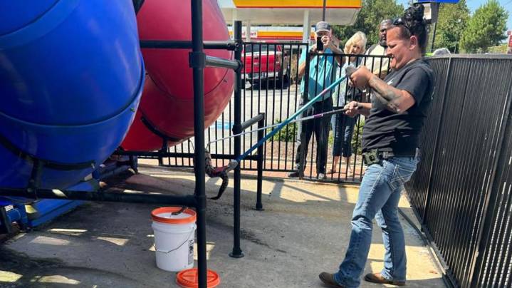Animal Enforcement Officer removes rattlesnake from Macon Burger King playground
