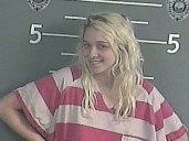 Smiling mom accused of leaving kids home alone to get high