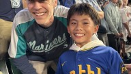 Mariners fan gifts historic ball to young boy : NPR