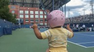 The biggest star of the U.S. Open might be a baby wearing a pink helmet