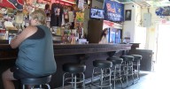 Owl Bar reopens as suspect faces charges for deadly shootings