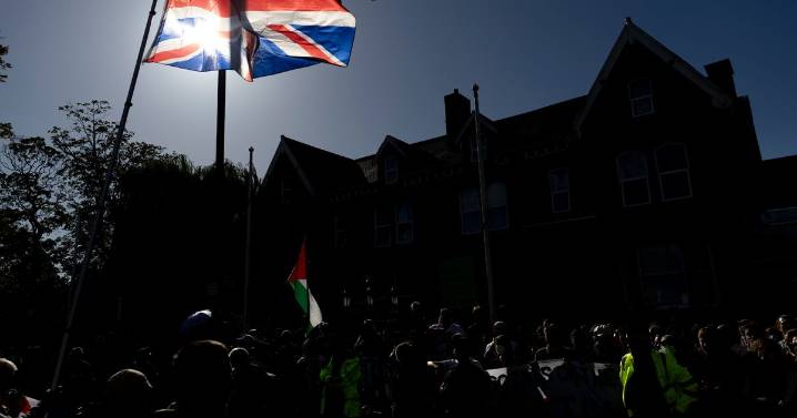 Police make six arrests as protestors demonstrate outside Manchester hotel