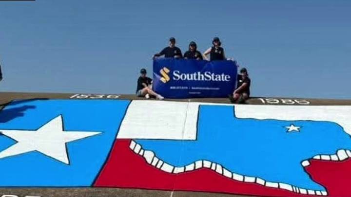Volunteers spruce up mural at Grapevine Lake