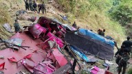 At least 15 dead as bus carrying tourists plunges 1,000ft after crashing through guardrails on Sri Lanka mountain road