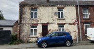 'Horrible - how can 10 people live in a building like this, on one floor with four bedrooms and a tiny bathroom?'
