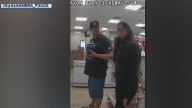 Domestic violence victim uses hand signals to call for help