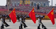 China shows off new missiles, drones and fighter jets in massive military parade