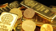 Gold punches to record on rate-cut outlook as ETFs draw in