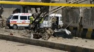 Destruction at scene of Pakistan security HQ suicide bombing