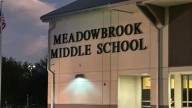 Man arrested after carrying gun on Orange County school campus amid open