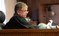 State watchdog says judge hid conflicts of interest. His ex