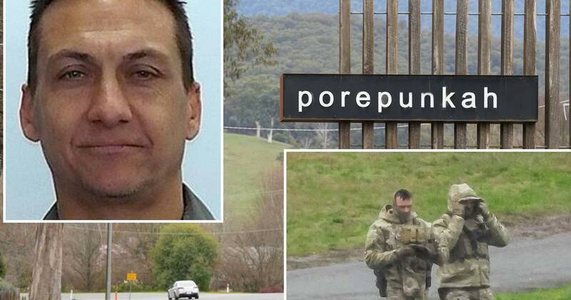 No let up in manhunt as thousands honour slain officer