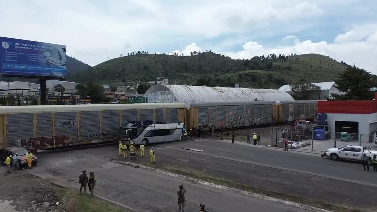 Train collision with bus in Mexico kills at least 10 people and injures dozens