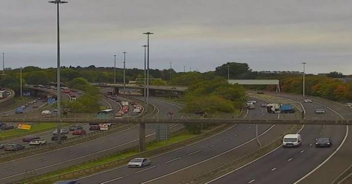 Glasgow M8 travel chaos as lorry crash spills 'load of wood’ across motorway