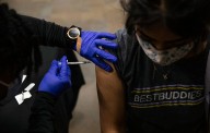 FDA official overruled scientists on wide access to COVID shots