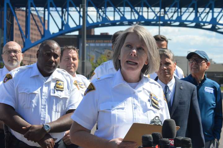 Flats shootout included rifle; two victims were facing away from shots, police say