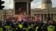 Dozens arrested after anti-immigration protesters scuffled with UK police