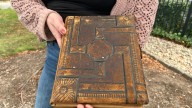 CT woman searches for the owner a vintage photo album dating back to the 1800s