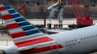 Family of 1 of the 67 Washington plane crash victims sues the FAA, Army and American Airlines
