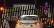 FBI entrance rammed by car 'with message' in 'act of terror' as manhunt launched