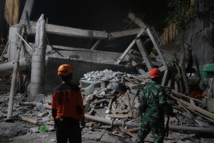 At least 65 students presumed buried under rubble after Indonesia school collapse