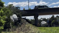 Driver alive after truck plunges off bridge onto highway at Yandina, Sunshine Coast