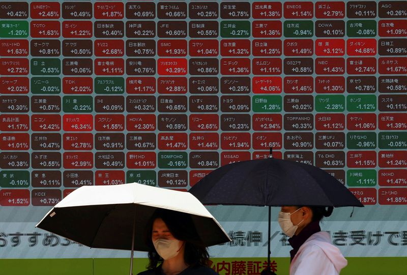 Japan, Taiwan shares set records on tech boost, Fed cut hope