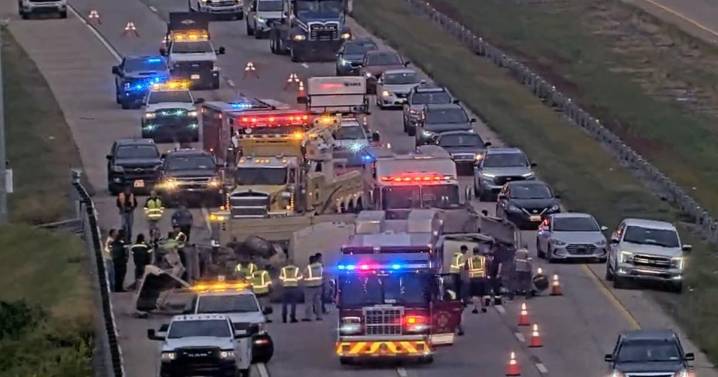 Rollover cement mixer jams traffic solid