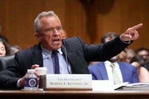 Kennedy tries to defend COVID-19 vaccine stance in raucous Senate hearing