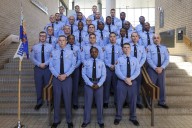 Georgia Gov. Brian Kemp swears in his daughter as a state trooper