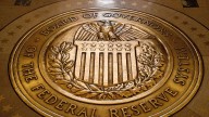 The Fed faces economic uncertainty and political pressure as it decides whether to cut rates