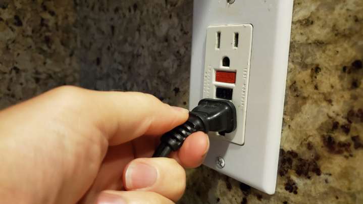 Why Do Some Outlets Have Red And Black Buttons? Here's What They Actually Do