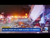 Big rig crash spills cans of beer, kegs across freeway