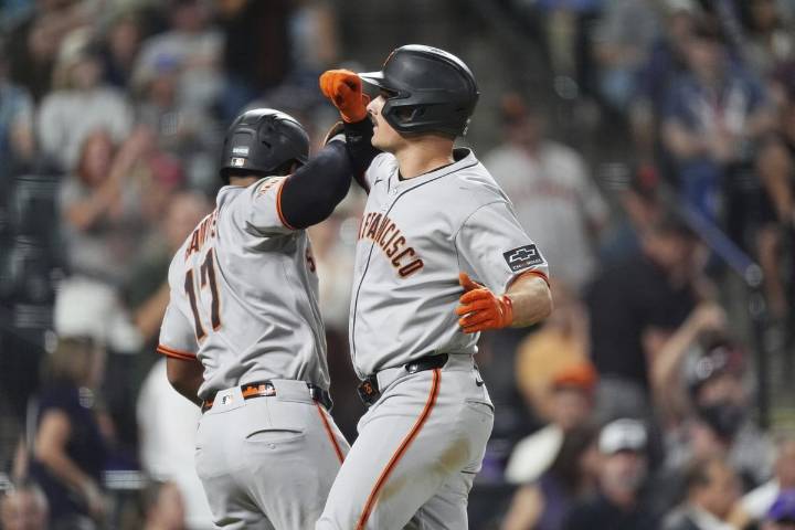 Chapman homers twice after appealing suspension to help the Giants beat the Rockies
