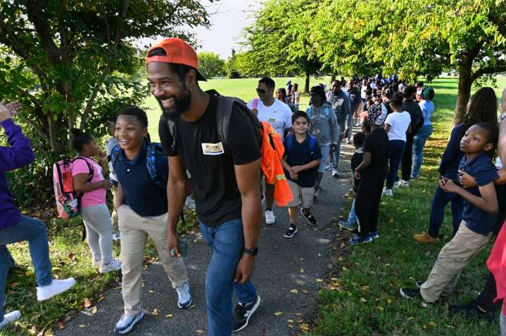 Baltimore dads walk kids to school for Million Fathers March