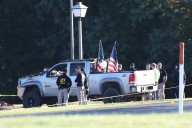 Police remain on scene at burned out Michigan church after shooting and fire leave 4 dead, 8 wounded