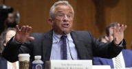 Kennedy tries to defend COVID-19 vaccine stance in raucous Senate hearing