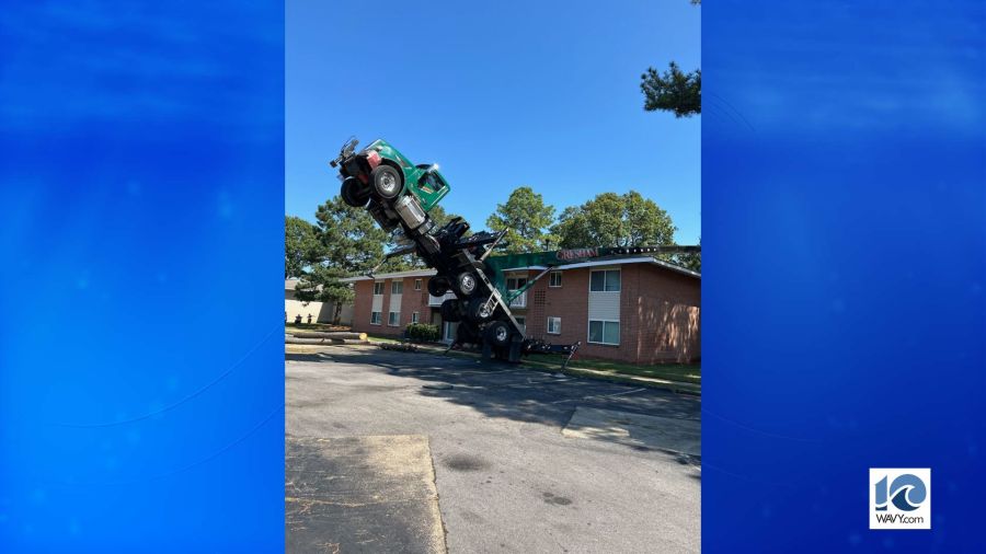 Crane tips over, lands on Virginia Beach apartment building