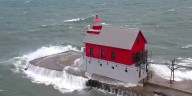 Waves batter Michigan lighthouse as powerful cold front sweeps through