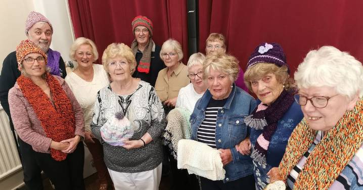 Tiverton seniors present £2,250 and hand-knitted winter warmers