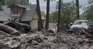 Mudslides trap drivers, bury roads and damage homes in southern California