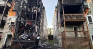 Firefighter, resident taken to hospital after large fire at 2 multi