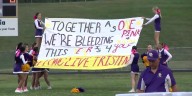 Rival football teams unite to honor slain 15