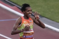 Kipyegon wins in a breeze for fourth world title at 1,500 meters