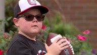 Ohio boy with rare genetic disorder throws first pitch at Akron Rubber Ducks game